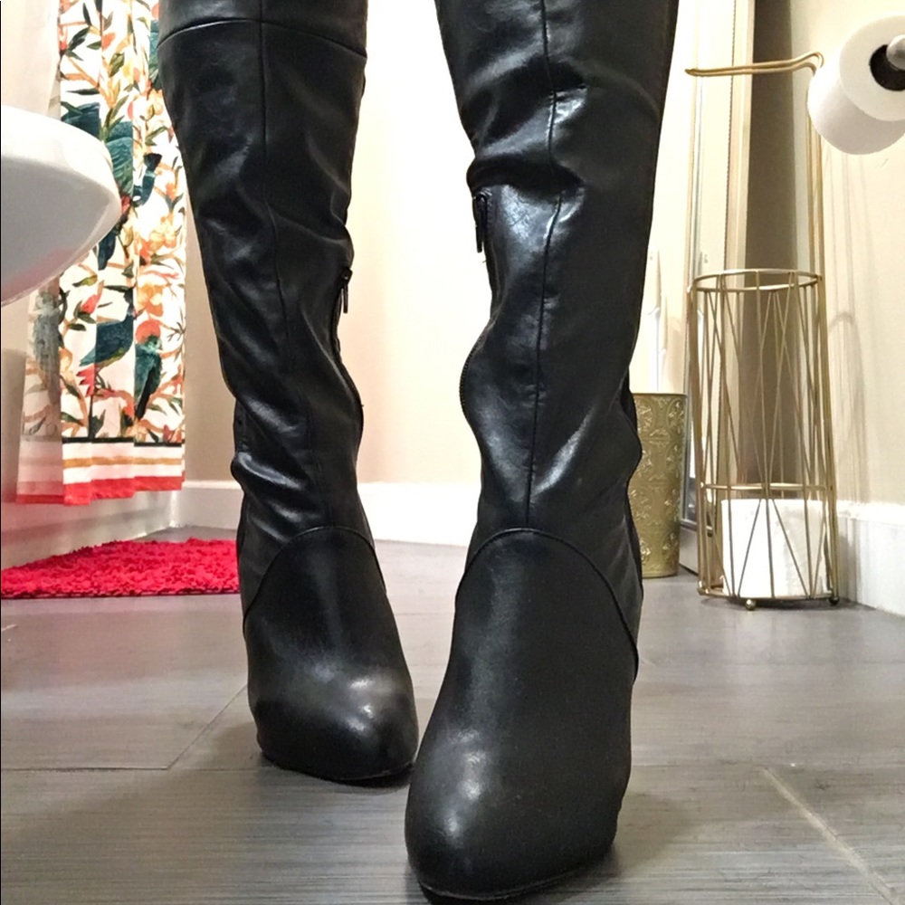 Black leather thigh high boots